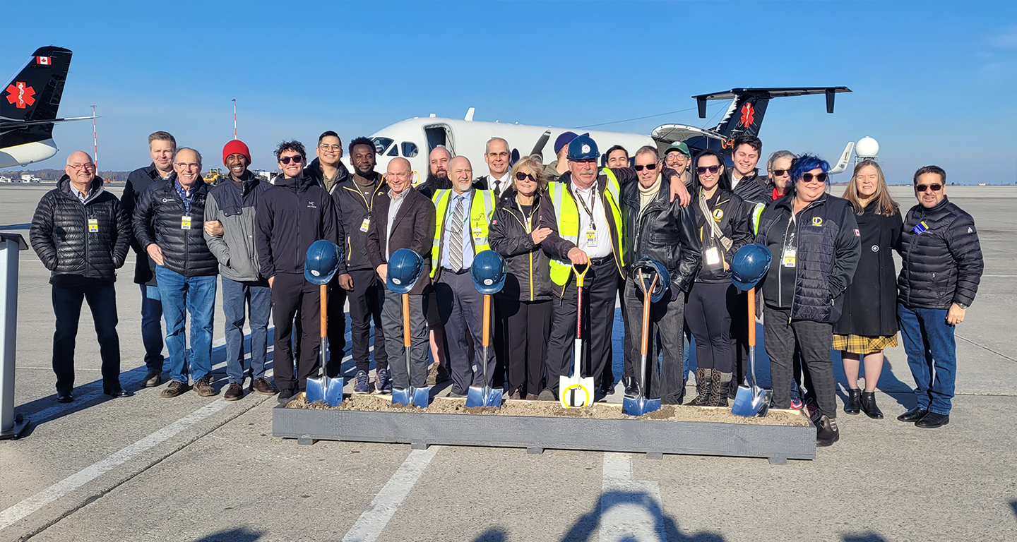 staff around ground breaking shovels